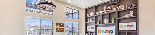 a living room filled with furniture and a large window