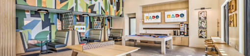 a game room with a foosball table and a ping pong table