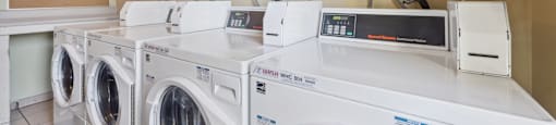 washing machines and dryers in the laundry room of a home
