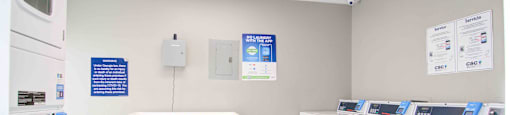 Clothes care center with washers and dryers at Place at Midway apartments in Douglasville near Lithia Springs, GA