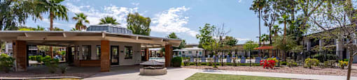 A building with a green lawn in front of it.