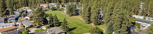 an aerial view of a neighborhood with houses and trees