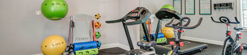 plenty of exercise equipment at the whispering winds apartments in pearland, tx