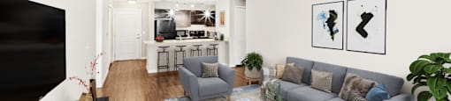 A living room with a grey couch and a coffee table.