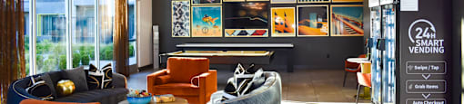 A room with a lot of furniture and a sign that says "24 Smart Vending".
