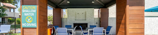 Covered poolside gathering area at Sono Tempe, a pet-friendly apartment community in Tempe, AZ.