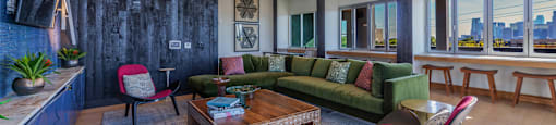 a living room filled with furniture and a large window