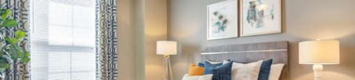Bedroom with large window providing natural light at Grande Club apartments in Duluth, GA 30096, near Lawrenceville