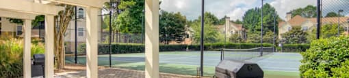 Outdoor picnic and grilling stations at Grande Club apartments in Duluth, GA 30096, near Lawrenceville.