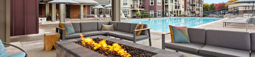 Apartments for Rent in Tigard, OR - Sygnii - A Cabana Firepit Overlooking the Pool with Comfortable Seating