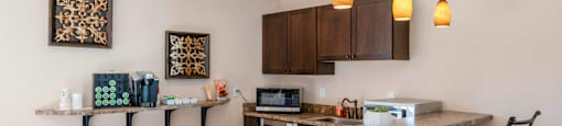 a kitchen with bar stools and a counter top with