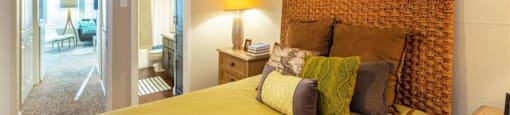 2 BR Apartments in League City, TX - Anchor at South Shore - Bedroom with Designer Ceiling Fan, Two Nightstands, and Private Bathroom