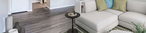 Living room with exquisite hardwood flooring at Sagewood at Westchase apartments in Houston, Texas.