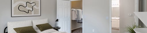 Bedroom with large walk-in closet at Sagewood at Westchase apartments in Houston, Texas.