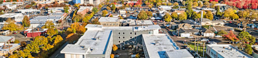 A large building with a parking lot in front of it.