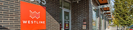 A Westline sign is on a brick building.