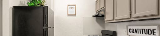 a kitchen with a sink and a refrigerator