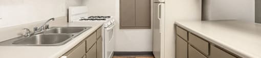 a kitchen with a sink and a refrigerator