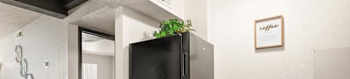 a kitchen with a refrigerator and a sink