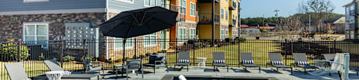 our apartments have a large pool with lounge chairs and umbrellas
