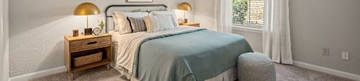 a bedroom with a bed and a window