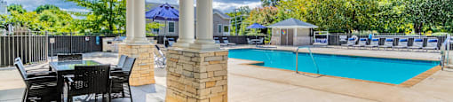 Outdoor covered seating area by the pool.