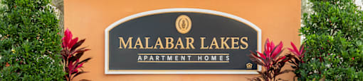 a sign for malabar lakes apartment homes