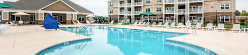 Large Swimming Pool with Complex in the Backgournd.