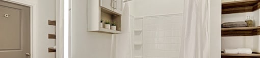 A white bathroom with a toilet, sink, and shower.
