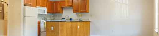 a kitchen and living room in a 555 waverly unit