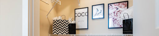 A white closet with shelves and bags.