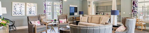 a living room with couches and chairs