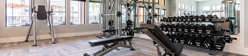 A spacious home gym with a variety of equipment.