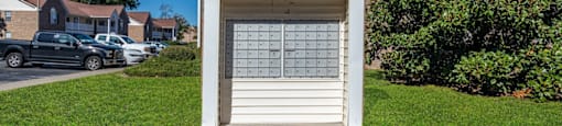 A small white garage with a calendar on the door.