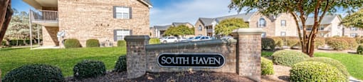 A sign that says South Haven stands in front of a building.