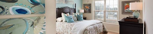 large bedroom with ceiling fan and natural light