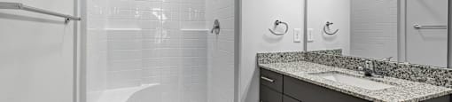 Altitude Raleigh apartment bathroom with walk-in shower and large vanity