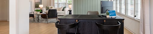 a home office with a desk and chairs