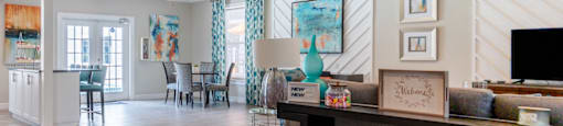 a resident clubhouse with a reception desk and dining room in the background