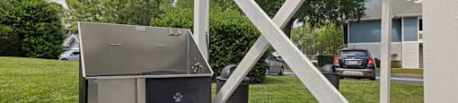 a grill on a porch in front of a house