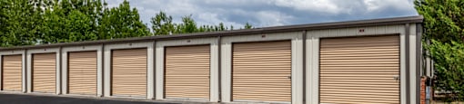 a row of garage doors on the side of a building