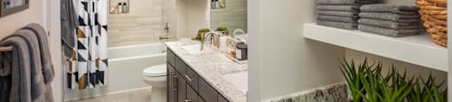 A bathroom with a shower and tub combo and storage at 27Seventy Lower Heights apartments in Houston, TX.