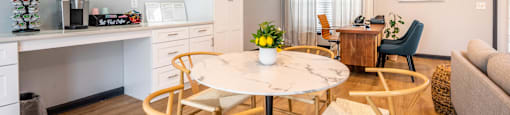 sitting areas by coffee bar in clubhouse