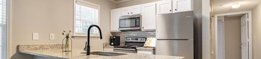 a kitchen with a breakfast bar and stools