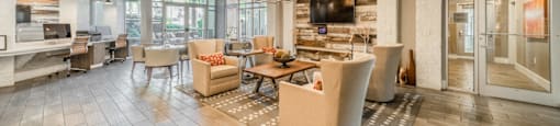 a living room with couches and chairs and a tv