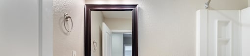 a bathroom with a toilet sink and a mirror