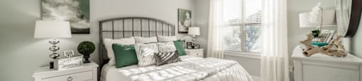 a bedroom with a bed and a ceiling fan