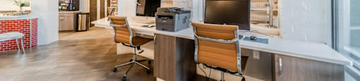 a break room with two desks and chairs in a restaurant