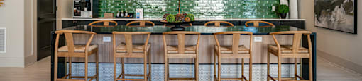 a dining room with a long table and chairs and a television