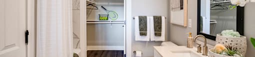 a bathroom with a shower and a sink and a toilet